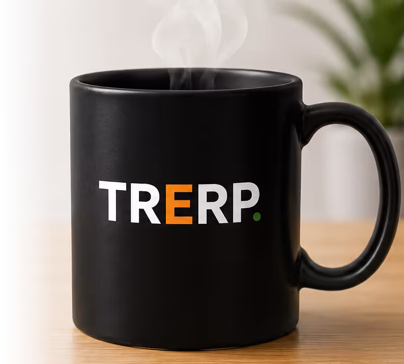 A TRERP-branded coffee mug on a desk